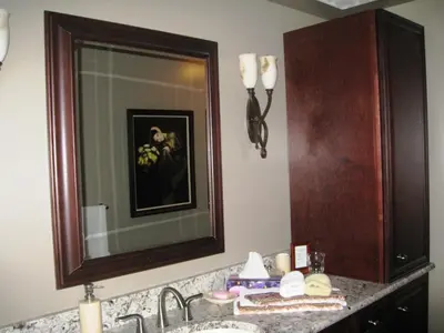 a bathroom with a sink and a mirror at McDougall Lane Bed & Breakfast in Drumheller