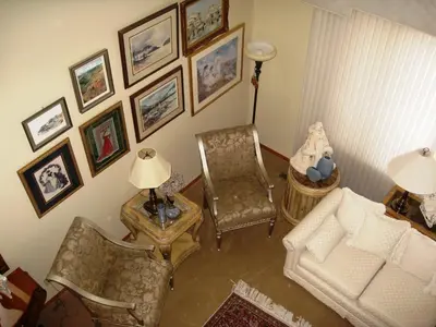 a living room with a couch and a chair at McDougall Lane Bed & Breakfast in Drumheller