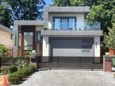a house with a large garage in front of it at Rose Garden Vacation Studio in Richmond
