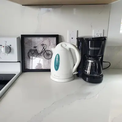 a kitchen counter with a toaster and a coffee maker at Garden House Near Heritage Park-Coliseum -HWY 1-Fishing-Cultus Lake in Chilliwack