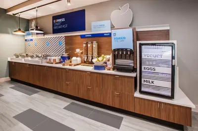 an apple store with a counter with an appleasteryasteryasteryasteryasteryasteryastery at Holiday Inn Express Fort St John by IHG in Fort Saint John