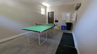 a ping pong table in a room with a ping pong ball at Altitude #36 condo in Sun Peaks