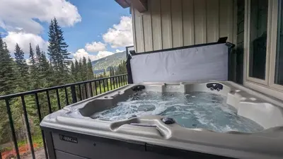 a bath tub sitting on top of a balcony at Altitude #36 condo in Sun Peaks