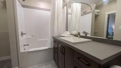 a bathroom with a sink and a shower at Altitude #36 condo in Sun Peaks