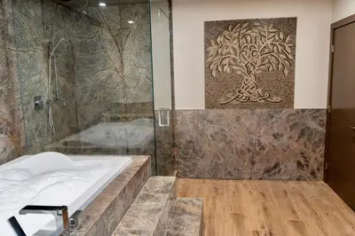 a bathroom with a shower and a bath tub at Romantic Luxury Retreat with Private Sauna & Spa, Pet Friendly, Elkside Hideout B&B in Canmore