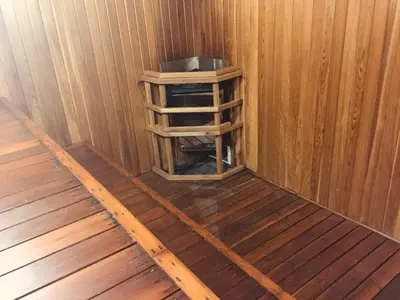 an inside view of a wooden cabin with a wooden shelf at Brewster Mountain Lodge in Banff