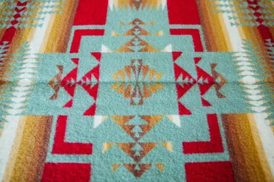 a close up of a rug with a pattern on it at Brewster Mountain Lodge in Banff
