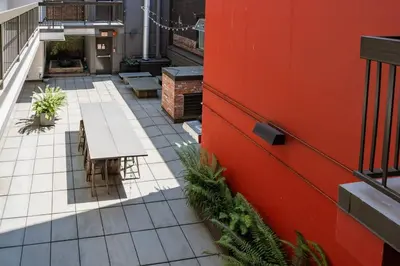 a patio with a table and benches on a building at Hidden Gem: Historical Gastown in Vancouver