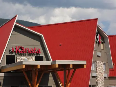 a building with a red roof at The Kanata by BCMInns Blairmore in Blairmore