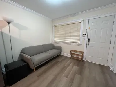 a living room with a couch and a window at Private suite 1 bed 1 bath 15 mins YVR and downtown \u8212\u9002\u5b89\u9759 in Vancouver