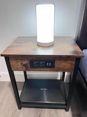 a wooden table with a vase on top of it at Private Entire Townhouse Retreat Close to Lake in Calgary