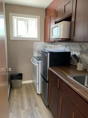 a kitchen with a sink and a dishwasher at Rondo Motel in Golden