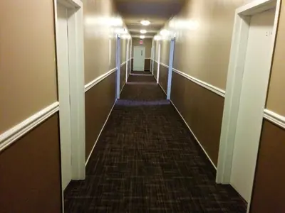 a long hallway in an office building at Bonnyville Hotel in Bonnyville