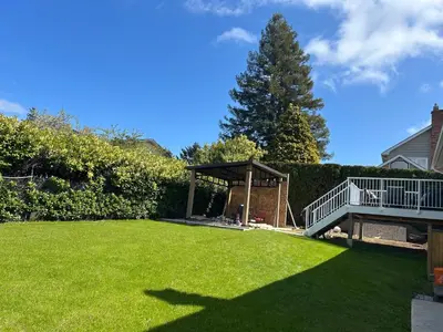 a yard with a gazebo and a green lawn at Blue Sea And Clear Sky B&B LICENCE NUMBER 18952 in Victoria