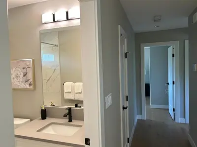 a bathroom with a sink and a mirror at Blue Sea And Clear Sky B&B LICENCE NUMBER 18952 in Victoria