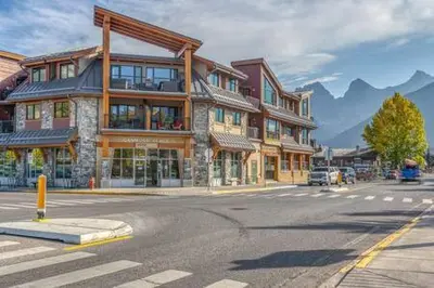 a large building on a street in a town at Best Views of Canmore - 2Bed 2Bath in Canmore
