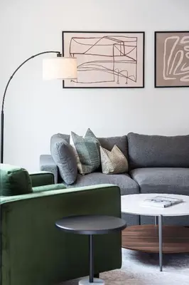 a living room with a couch and a table at Serenity Now by Revelstoke Vacations in Revelstoke