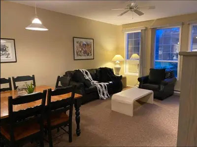 a living room with a couch and a table at Mountain View Vacation Villa Main Floor Unit, No Stairs in Fairmont Hot Springs