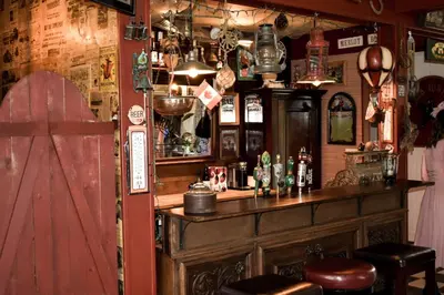 a bar in a pub with alot of items on the wall at The Hazelhouse in Chilliwack
