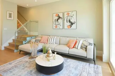 a living room with a couch and a table at Four bedrooms New Lovely Duplex -1626 in Vancouver