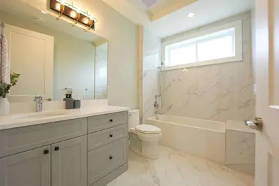 a bathroom with a tub and a toilet and a sink at Four bedrooms New Lovely Duplex House-1628 in Vancouver