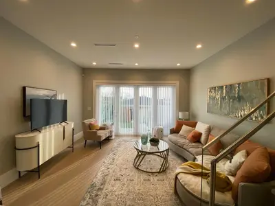 a living room with a couch and a tv at Four bedrooms New Lovely Duplex House-1628 in Vancouver