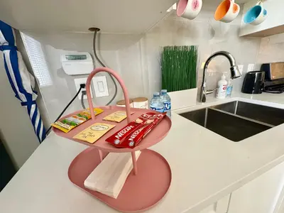 a pink table on a kitchen counter with a sink at Home sweet home in Richmond