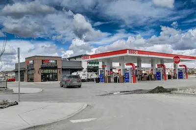 a car parked in front of a gas station at Cozy New Suite in Seton, South Calgary in Calgary