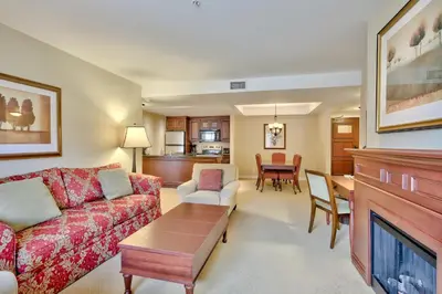 a living room with a couch and a table at Residences at the Sun Peaks Grand in Sun Peaks