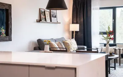 a living room with a couch and a table at The Selkirk House by Revelstoke Vacations in Revelstoke