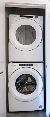 two washing machines stacked on top of each other at Revy's Stellar Retreat in Revelstoke