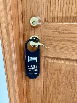a house door with a house label on it at Rocky Mountain View Bed & Breakfast in Cochrane