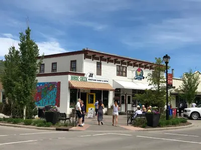 a group of people standing outside of a building at Rocky Mountain View Bed & Breakfast in Cochrane