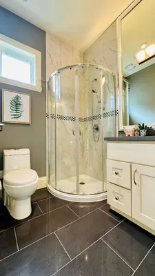 a bathroom with a shower and a toilet at Quiet Room in Richmond in Richmond