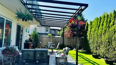 a patio with awning and a table and chairs at Quiet Room in Richmond in Richmond