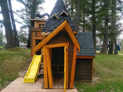 a play house with a slide in a park at Fairmont Mountain Bungalows in Fairmont Hot Springs