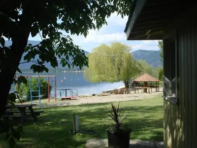 a view of a park with a playground and a lake at Jewel Bay Resort in Sorrento