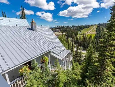 an aerial view of a house with a roof at The Alpine I No Service Fee's I Ski-in Ski-Out I in Silver Star