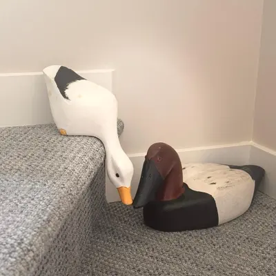 a stuffed swan and a duck toy next to a bed at Immersed in the scenery of Canmore in Canmore