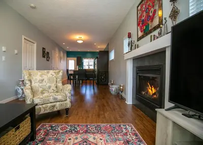 a living room with a couch and a fireplace at Entire 3-bedroom house Near Town in Victoria