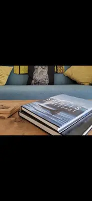a book sitting on top of a wooden table at Slack tide suite in Ucluelet