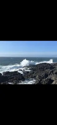 a view of the ocean from the top of a mountain at Slack tide suite in Ucluelet