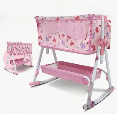 a pink high chair and a pink baby swing at Scorpio House Langley- ROOM 3 in Langley
