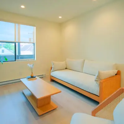 a living room with a couch and a coffee table at Newly Renovated 2 Bedroom Condo in Japantown! Near Railtown & Gastown! in Vancouver