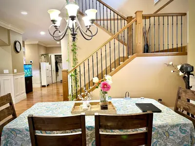 a dining room with a table with a laptop on it at Scorpio House Langley -ROOM 2 in Langley