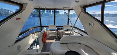 a boat with a bench and chairs on the water at GYPSIES DRIFTER in Vancouver