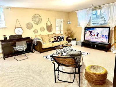 a living room with a couch and a tv at Scorpio House Langley -ROOM A in Langley