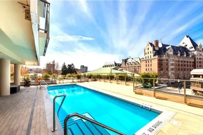 a swimming pool on the roof of a building at Waterfalls Hotel in Downtown With Stunning Views! in Victoria