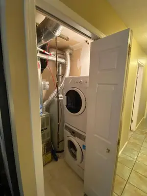 a washer and dryer in a laundry room at Mountain view walk to all in Canmore Canada in Canmore