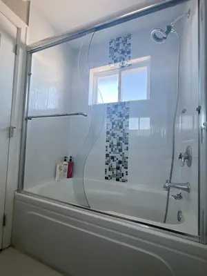 a glass shower in a bathroom with a tub at Near Skytrain and QUIET Private Bedroom Ensuite BathRM, Free Wifi & Coffee, Cozy in Burnaby